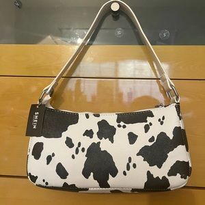 cute cow print purse never used!